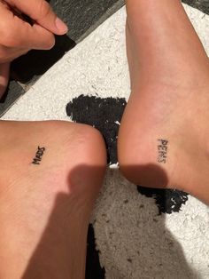 two people with small tattoos on their feet