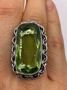 Large brilliant emerald green antique glass  Ornate German Silver  NOT 925  Vintage ring, does not tarnish Size 8.5 can be re sized, my jeweler charges a $20 fee All rings are shipped free in the US in a nice gift box.   Check out our over a THOUSAND great reviews Engraving is $4 per letter and is not always perfect depending on the piece. It can take a few days if the jeweler is busy. This is payable to Paypal Judithsltd@gmail.com Green Antique, Golden Ring, Glass Gems, Eye Ring, German Silver, Antique Glass, Vintage Ring, Cocktail Ring, Cocktail Rings