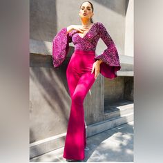 This Stunning Jumpsuit Features A Beautiful Sequin Top With Flared Sleeves And A Flattering V-Neckline. The Bottom Of The Jumpsuit Has A Comfortable And Stylish Fit With A Zip Closure, Perfect For Any Occasion. The Jumpsuit Is Made Of A High-Quality Polyester And Spandex Blend, Ensuring A Comfortable Fit That Is Also Machine Washable. Glamorous Pink V-neck Jumpsuits And Rompers, Elegant Fitted V-neck Jumpsuits And Rompers, Elegant High Waist Pink Jumpsuits And Rompers, Elegant Pink High-waist Jumpsuits And Rompers, Red Fitted V-neck Jumpsuit, Pink Stretch Jumpsuits And Rompers For Evening, Chic V-neck Jumpsuits And Rompers For Party, Fitted V-neck Jumpsuits For Party, Fitted V-neck Jumpsuits And Rompers For Party