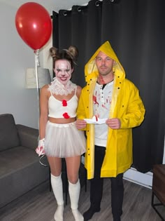 a man and woman in costumes standing next to each other