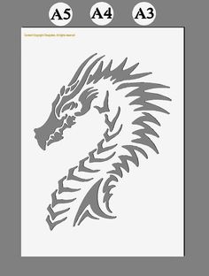 a stencil with the shape of a dragon's head in grey on a white background