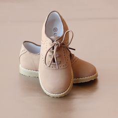 Handsome, fine nubuck khaki leather saddle oxford shoes for the young gent. Available in two tone (white/khaki) or single tone (full khaki). Toddler sizes 7-13, Youth sizes 1-2 Size Chart (In-sole length): Size 7 8 9 10 11 12 13 1 2 In. 5.44 5.8 6.25 6.5 6.8 7.13 7.5 7.75 8.2 School Shoes For Boys, Saddle Oxford Shoes, Leather School Shoes, Saddle Oxfords, Oxford Shoes Outfit, Boys School Shoes, Kids Leather Shoes, Kids Clothes Sale, Cheap Kids Clothes