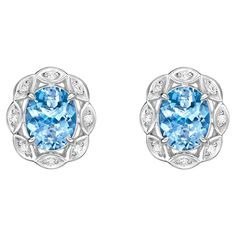 This collection features an array of aquamarines with an icy blue hue that is as cool as it gets! Accented with diamonds these Stud Earrings are made in white gold and present a classic yet elegant look. Aquamarine stud Earrings in 18Karat White Gold with White Diamond. Aquamarine: 4.618 carat, 10X8mm size, Oval shape. White Diamond: 0.21 carat, 1.50mm size, round shape, G color, VS clarity. Gold: 5.60g, 18Karat White Gold. Butterfly Pin and Push Back. E510 Luxury Blue Diamond Earrings With Halo Setting, Silver Earrings With Brilliant Cut Blue Topaz, Silver Blue Topaz Earrings With Brilliant Cut, White Gold Earrings With Blue Topaz And Diamond Accents, Cushion Earrings, Aquamarine Studs, Jewelry Design Drawing, Butterfly Pin, Icy Blue