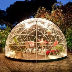 a large glass dome sitting on top of a patio