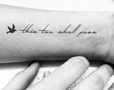 a person's arm with a bird on it that says, this too shall pass