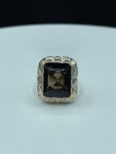 "This is a beautiful natural Smokey Quartz sterling silver ring size 7.5. The deck of this ring measures approximately 21.5 x 18.5 MM. The Smokey Quartz stone is emerald cut, has an amazing deep color, and is high quality as it is flawless. This ring is also stamped 925 and \"MEX\" as it was made in Mexico. This ring was handmade and it is very unique.This ring weighs 7.9 grams. This ring is new and unworn." Formal White Gold Topaz Ring With Rectangular Stone, Silver Ring With Polished Finish And Rectangular Stone, Silver Rings With Rectangular Stone And Polished Finish, Emerald Cut Gemstone Signet Ring In Sterling Silver, Fine Jewelry Octagon Ring With Polished Finish, Formal Octagon Topaz Ring In Sterling Silver, Formal Rectangular Hallmarked Emerald Ring, Silver Emerald Cut Gemstone Signet Ring, Formal Sterling Silver Signet Ring With Rectangular Stone