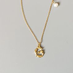 This is a simple yet beautiful letter pendant necklace on a dainty 18K gold plated 19"-21" chain. Makes the perfect personalized gift for any occasion. FEATURES Pendant Necklace in real 925 Sterling Silver Initial Pendant with Freshwater Pearl Comfortable to wear Lightweight and safe Hypoallergenic 🚚 Free Shipping Worldwide Estimated Delivery time: 8 to 13 business days 🎁 Ideal Gifts: Christmas gifts, family jewelry, friends gifts, couple gifts, anniversary gifts, birthday gifts, party gifts, Gold Initial Necklace With Adjustable Chain For Mother's Day, Gold Initial Necklace As Mother's Day Gift For Her, Gold Initial Necklace With Delicate Chain For Personalized Gift, Dainty 14k Gold Filled Initial Necklace Gift, Dainty Tarnish Resistant Name Necklace Gift, Dainty Tarnish-resistant Name Necklace Gift, Dainty Tarnish Resistant Name Necklace, Elegant 14k Gold Filled Initial Necklace Gift, Gold Plated Name Necklace With Initial Pendant Gift