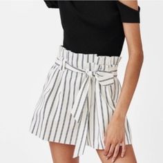 Brand New With Tags! This Pair Of Black And White Striped Shorts Comes With A Tie Belt And Side Pockets. It Is A Perfect Pair To Wear With A Basic Body Hugging Or Tight Top For That Simple Yet Elegant Look. The Material Of This Holds The Shape Well So It Is Good For Office/Formal Wear As Well. The Waist Is Elastic, Fits 26 - 27in Waist. Chic Shorts For Day Out, Chic Summer Bottoms For Day Out, Chic Bottoms For Summer Day Out, Chic White Workwear Shorts, Chic Cotton Shorts For Day Out, Chic White Bermuda Shorts, Chic High-waisted Shorts For Summer, Chic Striped Bottoms For Vacation, Chic Short Bottoms For Summer