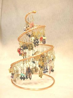 a small christmas tree made out of jewelry