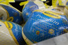 bags of bread wrapped in yellow and blue net to look like they are ready for shipping