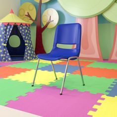 a black chair sitting on top of a colorful rug in a child's room