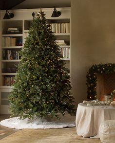 a living room with a christmas tree in the corner