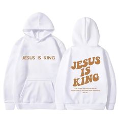 the jesus is king hoodie in white with gold lettering on it and an image of jesus