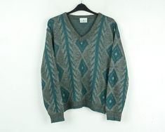 GREENWOODS Vtg Mens XL Knitted V-Neck Sweater Pullover Jumper Patterned Grey Top Size: XL Condition: Good used condition Colour: Grey, Green (Due to the quality differentiation between different monitors, the picture may not reflect the actual color of the item) Material: 100% Acrylic Weight: 470 g SKU: EV19 004 /eb/et/gr/as/rew2 Model in pictures usually wears size Large and is 185 cm (6,1 ft) tall  Measurements: Chest (armpit to armpit) 26" or 66 cm Sleeve (armpit to sleeve cuff) 19 1/4" or 49 Green V-neck Sweater For Winter, Green V-neck Winter Sweater, Retro Green V-neck Sweater, Jumper Patterns, Sleeve Cuff, Sweater Pullover, Grey Top, Grey Green, V Neck Sweater