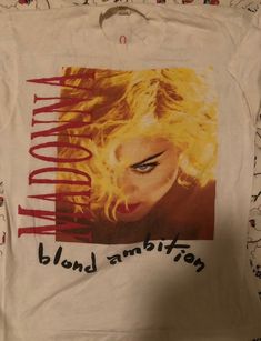 a white t - shirt with an image of a blonde woman's face on it