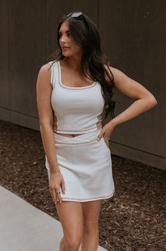 Front view of female model wearing the Hayden Cream & Mocha Tank which features Stretchy White Fabric, Taupe Side Colorblocking, Taupe Contrast Stitching, Square Neckline, Thick Straps and Cropped Waist White Fitted Tank Top With Contrast Trim, Fitted White Tank Top With Contrast Trim, White Fitted Chic Tank Top, Fitted Sleeveless Tank Top With Contrast Trim, White Color Block Tank Top For Summer, Chic White Stretch Tank Top, Fitted Tank Top With Contrast Trim For Summer, Spring Fitted Tank Top With Contrast Trim, Fitted Tank Top With Contrast Trim For Spring