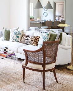 a living room filled with furniture and decor