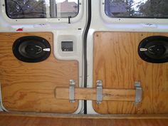 two speakers on the inside of a vehicle