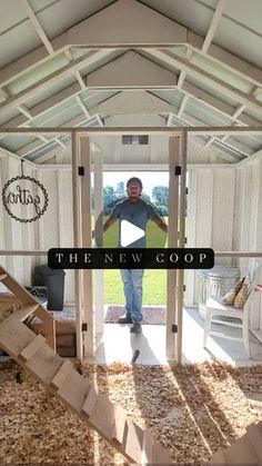 a man is standing in the doorway of a house