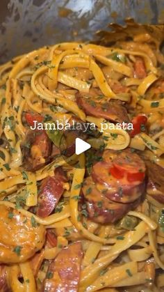 pasta with sausage and tomatoes in a pan