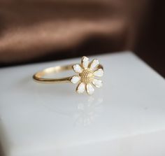 Daisy Ring 14k Gold Flower Band White Enamel Leaf Ring Minimalist Gold Ring Promise Anniversary Ring Thanksgiving Day Christmas Gift For Her ▶ 𝙋𝙍𝙊𝘿𝙐𝘾𝙏 𝙁𝙀𝘼𝙏𝙐𝙍𝙀𝙎 * 14k Yellow Gold Ring * Daisy Ring Size : 1cm x 1cm ( 0.39 in) ❤️ You can make the people you care about who have an important place in your life happy with a gold daisy ring, and you can give them a pleasant surprise. Chamomile means pure love. A quality design that will amaze you with its shine that you can choose for yo Dainty Gold Enamel Ring Gift, Delicate Flower-shaped Rings As Gifts, Elegant White Enamel Ring For Gift, White Flower Shaped Promise Ring, White Flower Shape Promise Ring, Dainty White Flower Ring For Promise, Dainty White Flower Promise Ring, Minimalist White Flower Ring Gift, Dainty Stackable Flower Ring As Gift