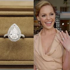 a woman is smiling and wearing an engagement ring with a pear shaped diamond on it