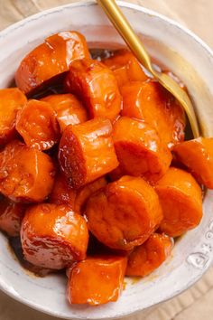 a white bowl filled with cooked sweet potatoes