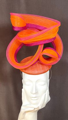 Do you remember those fairground rides that were around when we were kids?! The Helter Skelter in the best colour combo orange and pink.   A hand blocked orange sinamay button base, adorned with an orange and pink  crinoline twist.  Well balanced, a super comfy piece to wear. Finished with a hat elastic to suit your hair tone and or a head band for additional security. I never use glue in my millinery. Every item is hand stitched and finished to the highest standard. Perfect talking piece for th Pink Summer Costume Hats And Headpieces, Fun Pink Costume Hats And Headpieces For Summer, Pink Fun Costume Hats For Spring, Adjustable Pink Carnival Hat, Pink Fun Costume Hats For Carnival, Pink Adjustable Costume Hat For Carnival, Adjustable Pink Costume Hat For Carnival, Orange Mini Hat For Kentucky Derby Races, Orange Headpiece For Kentucky Derby Races