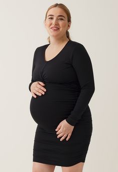 The Bodycon Maternity Dress is your stylish answer to this season’s festivities and many occasions to come. Pre-folded with an artful knot for a literal twist on the classic. Its wrap design doubles in function, flattering your curves and hiding its almost invisible nursing access. Made with a soft, stretchy high-quality jersey to give a beautiful body-hugging fit at every stage of motherhood.


Luxuriously draped soft jersey
Sustainable materials: 93% TENCEL™ lyocell and 7% elastane
Made in Tur Ruched V-neck Maternity Dress, Maternity V-neck Ruched Dress, Maternity V-neck Dress With Ruched Details, V-neck Ruched Maternity Dress, Black V-neck Maternity Dress, Elegant Long Sleeve Bump Friendly Dress, Maternity V-neck Bump Friendly Dress, Maternity Long Sleeve Ruched Dress, Bump-friendly V-neck Maternity Dress