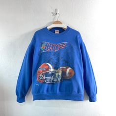 Vintage 90s Florida Gators Embroidered Crewneck Sweatshirt Team Sportswear  Condition : Used vintage Good conditions Details : (Look at the picture) Please Let me know if you have any      questions or More Photo Detail Brand : Nutmeg Mills  Made in : USA  Measurement Size On Tag : M, (fit like L) Pit to pit : 23.25 inches Length : 26 inches Material : Cotton Polyester Color : Blue  *Please keep in mind that our items are vintage so they may show some signs of wear and tear *Please read everything before buying  No Cancel  No Refund  No Return  payment Accept PayPal only. Please give us your phone number together with address after you purchasing.( No P.O Box  shipping to worldwide Item will shipped in 1-3 days after payment. ( remote area The shipping cost is higher) Thank you :)