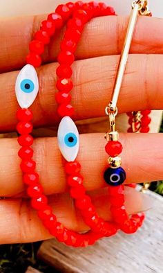 Mother of Pearl Freshwater Shell Evil Eye 4mm Red 4mm Porcelain beads  14kt Gold filled Lobster clasp and components 14Kt gold plated charm bar  Shell Eye Eye will give you a sense of tranquility with natural soft colors white & blue  Represent defense of evil from those that wish bad on you . Beautiful vibrant red porcelain beads  Similar to the red string in beads  Protection over anyone wishing bad on you  Beautifully packaged (HANDMADE Please measure wrist & message wrist size  Also which bracelet you prefer  Example : Wrist 6.5 Red bar or  Wrist 6.0 Evil eye  Thank you for supporting small businesses 🧿🪬 Red Beaded Evil Eye Bracelet With Round Beads, Colorful Beads Red Evil Eye Bracelet, Red Evil Eye Round Bead Jewelry, Red Evil Eye Round Beads Jewelry, Red Beaded Evil Eye Bracelet, Charm Bar, Red Porcelain, Glass Evil Eye, Red Bar