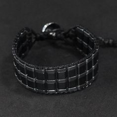 Modern Black Braided Bracelet As Gift, Modern Black Braided Bracelets As Gift, Modern Black Braided Bracelet Gift, Modern Black Braided Bracelets For Gift, Casual Black Hand-wrapped Bracelets, Casual Black Hand Wrapped Bracelets, Modern Adjustable Black Beaded Bracelets, Modern Adjustable Black Wrap Bracelet, Casual Black Hematite Jewelry