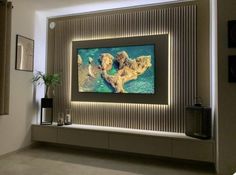 a large television mounted to the side of a wall in a living room with modern decor