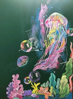 an underwater scene with jellyfish, seaweed and other marine creatures painted on the wall