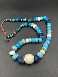 Antique Naga Beads Necklace from Nagaland Big blue glass beads necklace from the Naga people inhabiting the region of Nagaland, in NE India and NW of Myanmar. the age of this beads is around 100 to 200 years old its traditional cultural beads. good condition of beads we provide fast and free shipping service world wide Traditional Blue Beads With Natural Stones, Traditional Agate Necklace With Colorful Beads, Traditional Agate Necklace With Polished Beads, Traditional Agate Beaded Jewelry, Blue Amulet Style Necklace With Large Beads, Traditional Blue Polished Beads Gems And Cabochons, Ancient Glass Beads, Antique Large Agate Beads, Traditional Blue Polished Beads, Gems, And Cabochons