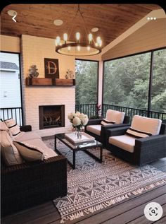 a living room filled with furniture and a fire place