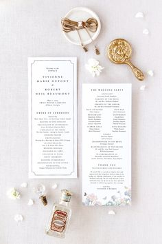 the wedding ceremony program is displayed next to a bottle of liquor and a gold spoon