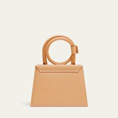 Jacquemus "Le Chiquito Noeud" top handle bag in leather  Coil top handle with snap strap closure  Detachable, adjustable crossbody strap Can be worn as a top handle or crossbody bag  Flap top with magnetic closure  Interior, one card slot  Lining: Cotton Approx. 10.8"H x 7"W x 5.5"D Made in Italy Shopping Satchel With Detachable Strap And Round Handle, Chic Satchel With Adjustable Strap And Round Handle, Elegant Crossbody Satchel With Single Handle, Chic Handheld Satchel With Single Handle, Chic Handheld Flap Bag With Top Carry Handle, Chic Flap Bag With Detachable Handle, Top Handle Box Bag With Adjustable Strap, Luxury Shoulder Bag Satchel With Single Handle, Chic Handheld Flap Bag With Detachable Handle