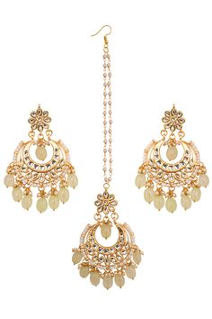 Embellished with kundan and beaded detail chandbali & mang tika set. Product Features: Color: Cream Gold Toned Kundan Inspired Mang Tika with Chanbali Material: Metal copper alloy, Semiprecious pastel beads Work : kundan with meenkari on back side Dimension: Earring :Length - 3.1in, Width - 2in Mang Tika : Length -8 in width - 2in Pack Of: 1 pair earrings 1 mang tika Occasion: festive and wedding Disclaimer: There will be slight difference in digital to actual image Anarkali Style Chandbalis With Zari Work For Navratri, Festive Kundan Sets With Latkans, Diwali Kundan Chandbali Sets, Festive Mirror Work Tikka, Festive Anarkali Chandbalis With Cutdana, Festive Kundan Chandbalis In Anarkali Style, Eid Kundan Chandbali Sets, Bollywood Kundan Chandbali Sets, Eid Kundan Chandbali Necklace With Stone Work