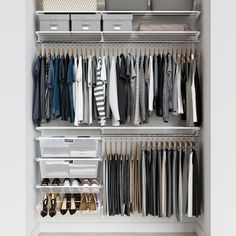 an organized closet with clothes and shoes