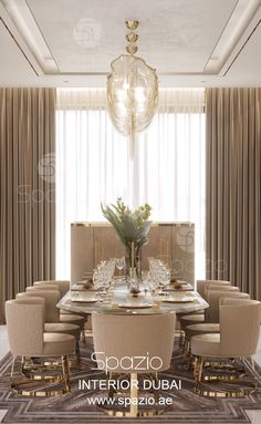 an elegant dining room with beige chairs and a chandelier hanging from the ceiling