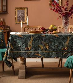 a dining room table covered with a blue cloth