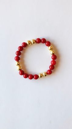 Perfect bracelet to add to your Holiday stack!  This listing is for 1 bracelet Made with a beautiful 8mm red gemstone beads and brushed gold plated beads. The beads are strung on a durable, stretchy cord so they are easy and comfortable to wear.  Mix+match your bracelets to create your own style! Gold Beaded Bracelets For Holiday, Elegant Red Stretch Bracelet With 8mm Beads, Everyday Red Stretch Bracelet With Round Beads, Adjustable Red Stretch Bracelet For Everyday, Red Round Beads Bracelet For Everyday, Red 8mm Beads Jewelry For Festive Occasion, Adjustable Red Stretch Bracelet With 8mm Beads, Adjustable Gold Beaded Bracelets For Holiday, Red Spiritual Beaded Bracelets For Everyday