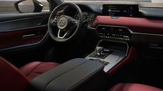 the interior of a car with red leather seats and steering wheel, dash board and dashboard