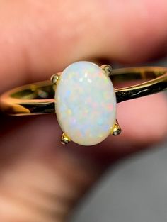 Australian opal set in gold plated 925 sterling silver ring Ring: made from gold plated 925 sterling silver Size 6.5 Stone: solid Australian opal mined from Coober Pedy 0.9 carats 8x6 mm Classic Opal Moonstone Ring As Gift, Classic Yellow Gold Opal Ring, Classic Ethiopian Opal Gemstone Rings, Yellow Gold Opal Ring Oval Cabochon For Gift, Gold Ethiopian Opal Ring Hallmarked, Yellow Gold Opal Ring Hallmarked As Gift, Yellow Gold Hallmarked Opal Ring As A Gift, Yellow Gold Oval Opal Ring In Sterling Silver, Yellow Gold Hallmarked Opal Ring For Gift