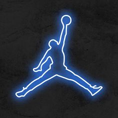 the air jordan neon sign is lit up in blue and white on a black wall