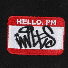 the back of a black jacket with red and white patches on it that says hello, i'm