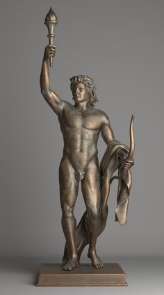 a bronze statue of a man holding a lamp in one hand and an animal in the other