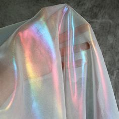 This rainbow reflective fabric is designed specifically for making clothing and accessories that stand out in a crowd. The fabric is iridescent and features a rainbow holographic laser effect. It's designed specifically for making attention-grabbing pieces that will turn heads. Dimension: Width: 150cm / 59 inches Wash: Dry wash is recommened The fabric is top qulaity designer farbric on the market. It is lightness, color illusion, good drape, and a cool touch. It is perfect for swimwear, dresses Color Illusions, Holographic Fabric, Iridescent Fabric, Dance Clothing, Posing Suits, Shiny Fabric, Dance Outfits, Chiffon Fabric, Primavera Estate