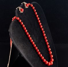 Vintage 1960's 18k Yellow Gold Natural AAA Red Coral Necklace Earring Set 57.37gMetal Information: 18k Yellow GoldTotal Weight: 57.37gNecklace Width: 12mm - 6.1mmNecklace Length: 25"Earring Dimensions: 18mm x 12.8mmCirca: 1960'sStone InformationMain StoneGem Type: CoralShape: Round Bead (12mm - 6.1mm)Color: RedClarity/Quality: AAANumber of Stones: 79Accent StonesGem Type: CoralShape: Oval Cabochon (18mm x 8.2mm)Color: RedClarity/Quality: AAANumber of Stones: 1Estimated Retail Price: $7690.00OUR Red Costume Jewelry Sets For Formal Occasions, Red Jewelry With Earrings For Evening, Vintage Red Jewelry For Evening, Classic Red Jewelry With Round Beads, Formal Red Round Beaded Jewelry, Formal Red Jewelry With Matching Earrings, Traditional Jewelry With Matching Earrings For Evening, Traditional Single Strand Formal Jewelry, Fine Jewelry Red Jewelry For Evening